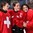 ST. CATHARINES, CANADA - JANUARY 14: From left to right Shannon Sigrist #9, Kaleigh Quennec #18 and Chiara Pfosi #30 of Team Switzerland celebrate a 2-0 victory over Team France during relegation round action at the 2016 IIHF Ice Hockey U18 Women's World Championship. (Photo by Francois Laplante/HHOF-IIHF Images)

